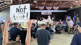 Democratic supporters in the audience react to Republican Representative Ben Cline's remarks at the Labor Day festival in Buena Vista.