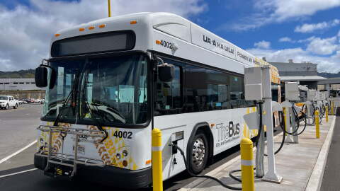 FILE - All-electric TheBus in Honolulu.