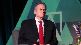 Gov. Mike Dunleavy listens to Glenfarne CEO Brendan Duval talk about the Alaska LNG Project during a panel on Thursday, June 5, 2025 in Anchorage, Alaska.