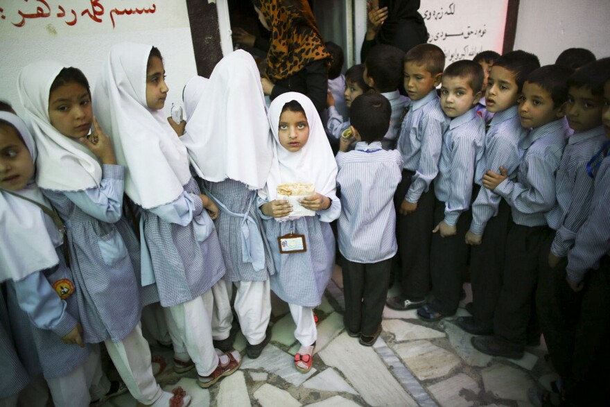 Gilkey would make kids laugh — and then they'd be willing to let him take their picture. Above: schoolkids in Kabul, Afghanistan, in May 2015.