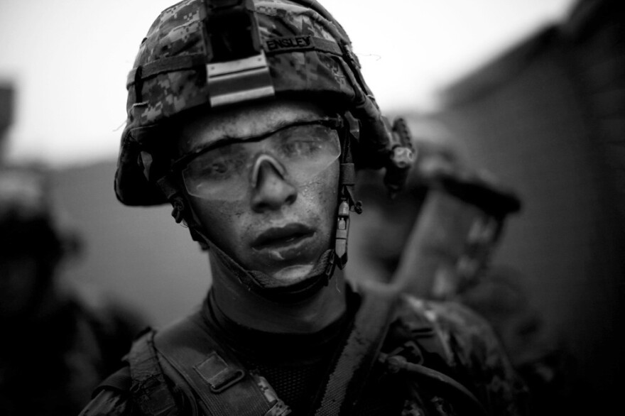 Bravo Company's Pvt. Cody Lee Ensley walks through the safety of the gates at an American base after a daylong fierce attack by insurgents near Payendi. <em>From the story "<a href="http://www.npr.org/2010/10/22/130756452/signs-of-traction-in-u-s-fight-against-afghan-taliban" target="_blank">Signs Of Traction In U.S. Fight Against Afghan Taliban</a>," 2010. </em>