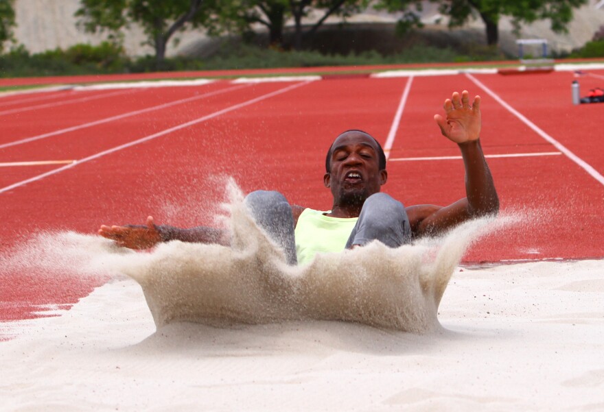 Gillette lands a long jump. At 17, Gillette won his first long jump national championship.  Two years later, still a teenager, he won the first of three straight Paralympic silver medals.