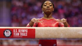 Simone Biles prepares to compete on the balance beam during the Women's competition of the 2021 U.S. Gymnastics Olympic Trials at America’s Center in St Louis, Missouri.