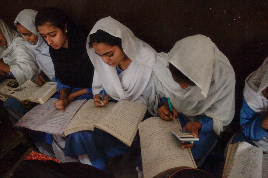 Young women study in a math class in a public high school for girls in Meer Muhammad.