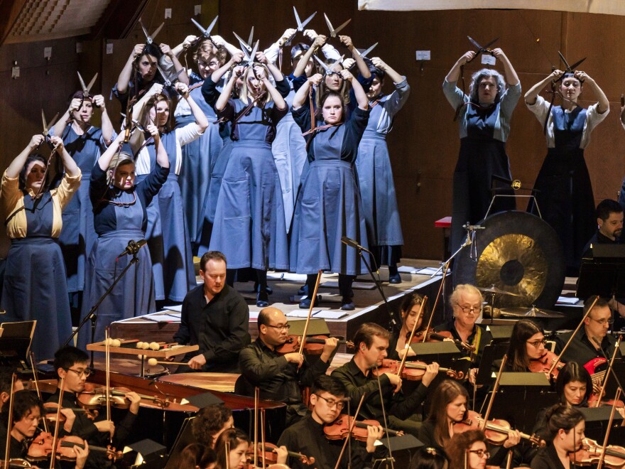 Members of the 146-voice chorus, dressed as garment workers, in composer Julia Wolfe's Fire In My Mouth, which documents the 1911 Triangle Shirtwaist Factory Fire in New York.