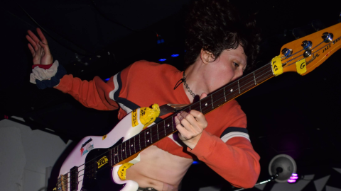 Iss Manzi, bassist and vocalist of Film and Gender, jumps as he plays bass at No Fun on Sept. 24, 2026