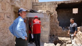 Baltimore-based Catholic Relief Services president and CEO Sean Callahan visits Syrian families in rural Aleppo to witness the devastation to homes and needs for repair. Photos: Nihad Al-Hassan for CRS