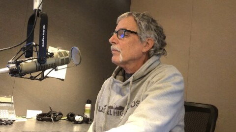 Gary Sexton sitting at a microphone