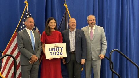 GOP candidates Anthony DiLorenzo, Gov. Kelly Ayotte, and John E. Sununu pose with RNC Chairman Joe Gruters at Unity Breakfast in Concord, Monday.