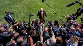 President Donald Trump speaks with reporters before departing the White House for a trip to Beijing, to meet with China's President Xi Jinping, Tuesday, May 12, 2026, in Washington. (AP Photo/Julia Demaree Nikhinson)