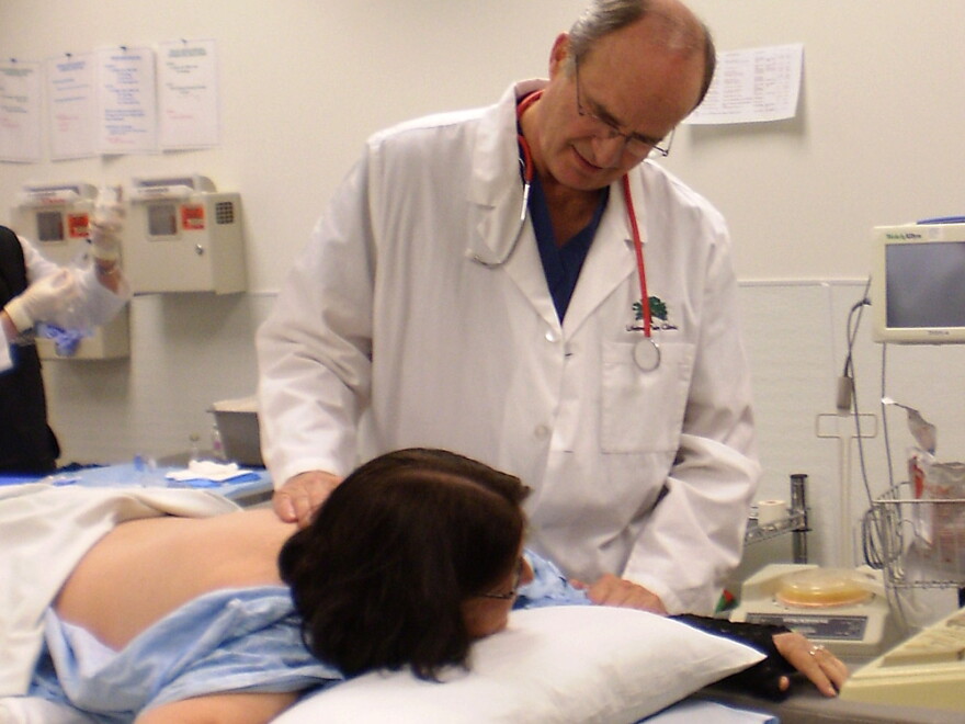 Dr. Lynn Webster, a pain specialist, treats a patient at Lifetree Clinical Research and Pain Clinic in Salt Lake City.