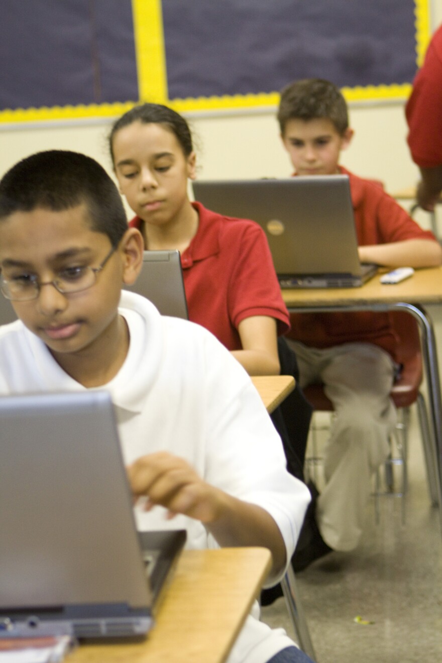 Students in a Guilford County school classroom on computers.