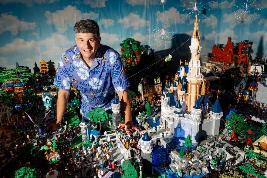 Doug Schieppe, the schoolteacher behind the popular Kragle Kreations Lego-building account, alongside a small portion of his replica Disney World he built at his O’Fallon home on Aug. 6.