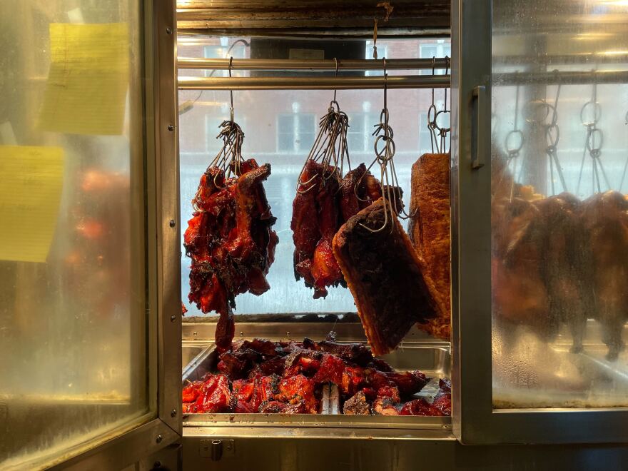 Some of Kau Kau BBQ Restaurant's food hangs in the window at the restaurant in Seattle's Chinatown-International District. This time of year, the restaurant also makes turkeys for Thanksgiving, with a wildly popular following.