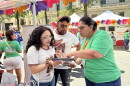 An El Pueblo volunteer helping register a voter at Fiesta del Pueblo, a festival El Pueblo organized in downtown Raleigh on Sept. 20, 2026.