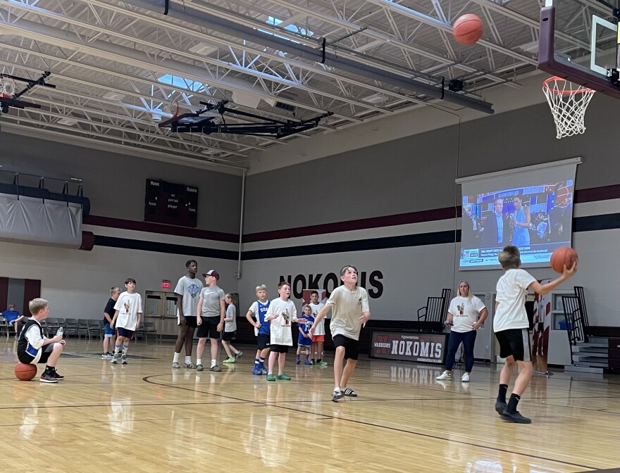 Kids play a game of knockout at Nokomis Regional High School, competing for signed Cooper Flagg memorabilia- while waiting to see Flagg in the NBA draft.