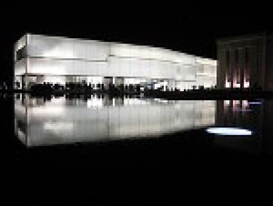 A black-and-white photo of the Bloch Building at night.