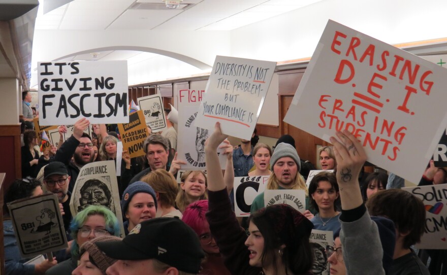 Student protestors pack the hallway outside the University of Cincinnati's Board of Trustees meeting