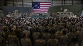 Afghan's President Ashraf Ghani and US President Donald Trump speak to US troops during a surprise visit at Bagram Air Field in Afghanistan.