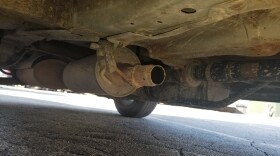  Underside of vehicle missing its catalytic converter after a theft
