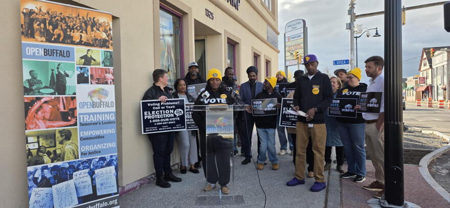 Open Buffalo Executive Director Franchell Parker (at podium) joins other local leaders in calling for stronger protections for voters’ rights and increased participation ahead of Election Day during a rally Friday, Oct. 30, 2026.