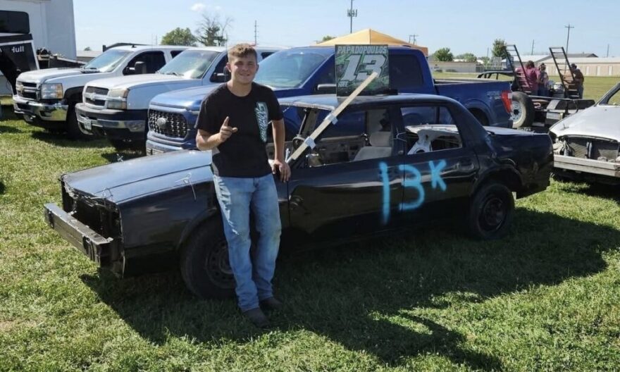 Korbin Papadopoulos poses before his first demolition derby competition in August 2025 in Macon. He chose his father's derby number, 13, for his car and added K for his first name.
