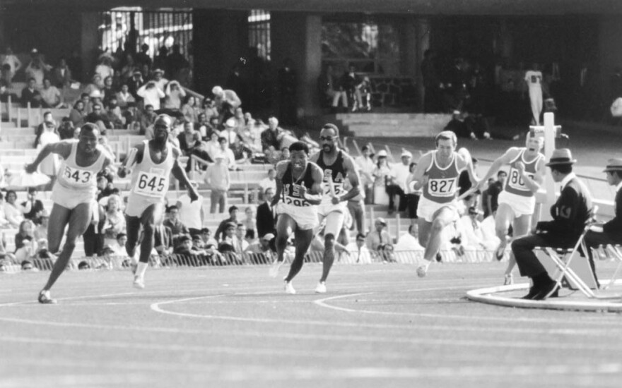 Melvin Pender receives the hand-off in the 4 x 100 meter relay during the 1968 Olympics, for which he won a gold medal.