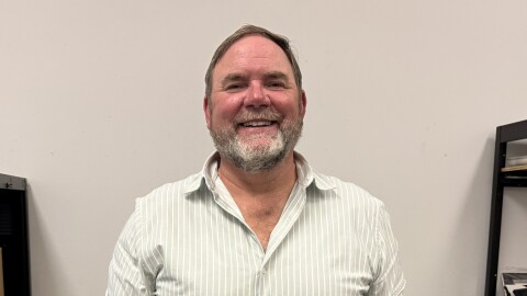 Kenai Peninsula Borough School District Superintendent Clayton Holland stands in the KDLL office on Tuesday, June 16, 2026 in Kenai, Alaska.