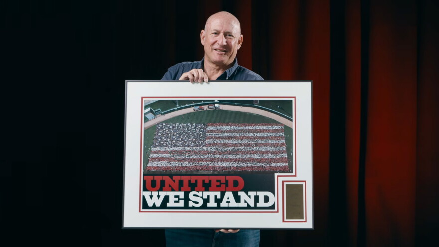 In the days after the Sept. 11, 2001, terrorist attacks, thousands of Tucsonans came together at Tucson Electric Park, now known as Kino Stadium, to form a human American flag. David Sanders was the photographer who captured the iconic local image.