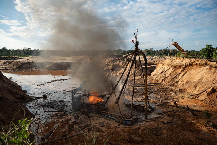 FILE - Members of the Peruvian Navy destroy a dredge used for illegal mining near the Malinowski River in the Tambopata National Reserve in Puerto Maldonado, Peru, Aug. 11, 2026. (AP Photo/Guadalupe Pardo, File)