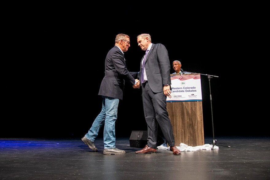 U.S. Rep. Jeff Hurd, incumbent candidate for Colorado's 3rd Congressional District (right), shakes hands with challenger Dwayne Romero after their debate at a Club 20 at the Asteria Theater in Grand Junction. Sept. 19, 2026.
