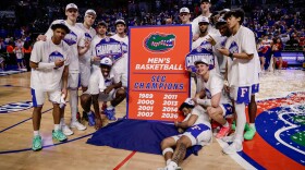 Feb 28, 2026; Gainesville, Florida, USA; Florida Gators players pose for a team photo while celebrating the SEC regular season championship following the game against the Arkansas Razorbacks at Exactech Arena at the Stephen C. O'Connell Center. Mandatory Credit: Travis Register-Imagn Images