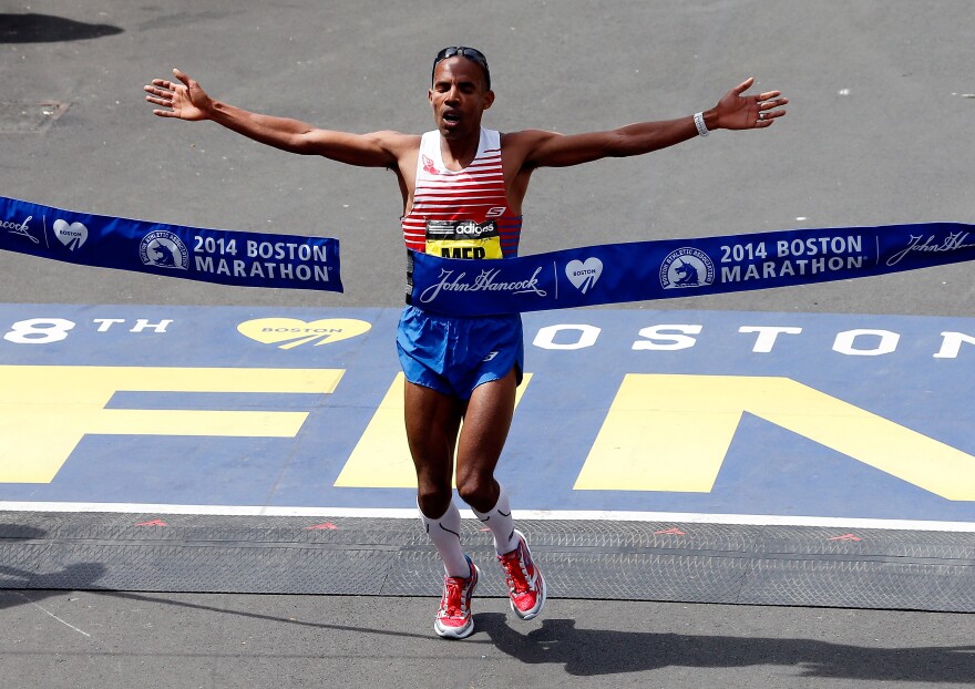American Meb Keflezighi crosses the finish line to win the 118th Boston Marathon on Monday. He finished with a time of 2:08:37.