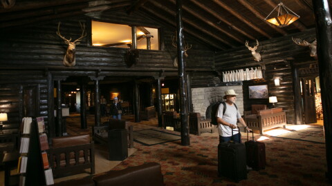 Tourists check out of the El Tovar Hotel as lodging along the rim of the canyon was shut down due to flooding, Monday, Aug. 31, 2026, at Grand Canyon National Park, Ariz.