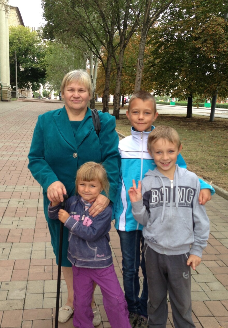 Ludmila Timofeyvna and her grandchildren, taking advantage of the cease-fire between separatists and the Ukrainian government, are once again going outdoors in Donetsk.