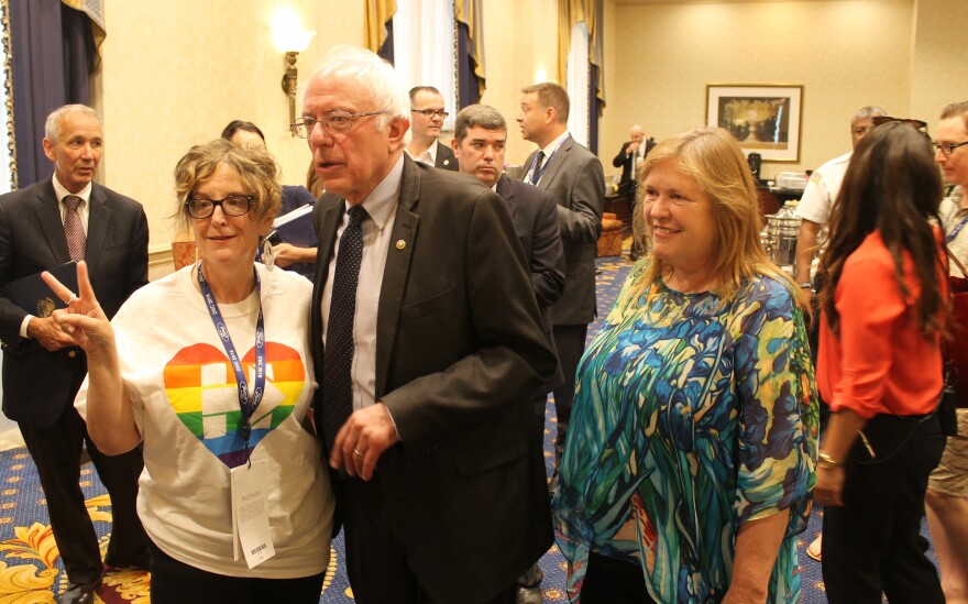 Bernie Sanders poses with a fan in July 2016 at the Courtyard Marriott Hotel in Philadelphia. 