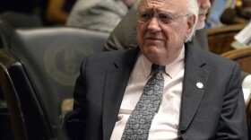 FILE - Kentucky Sen. Julian Carroll listens as fellow members of the Senate speak about a bill at the state Capitol, March, 24, 2015, in Frankfort, Ky. Former Kentucky Gov. Carroll, who led efforts to improve public schools and modernize the state’s judicial system — and who later rekindled his political career as a state legislator — died Sunday, Dec. 10, 2023, his family said. He was 92. (AP Photo/Timothy D. Easley, File)