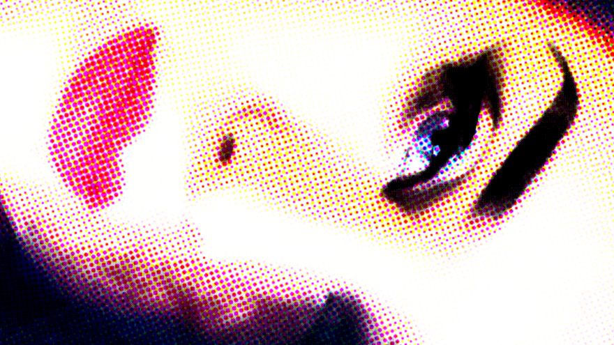  A highly stylized image shows a close-up of a person's face with makeup, oriented horizontally.