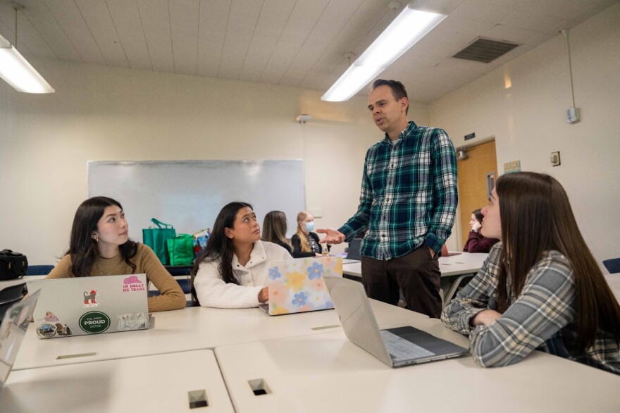 University of the Pacific associate professor Justin Low speaks to psychology program students.