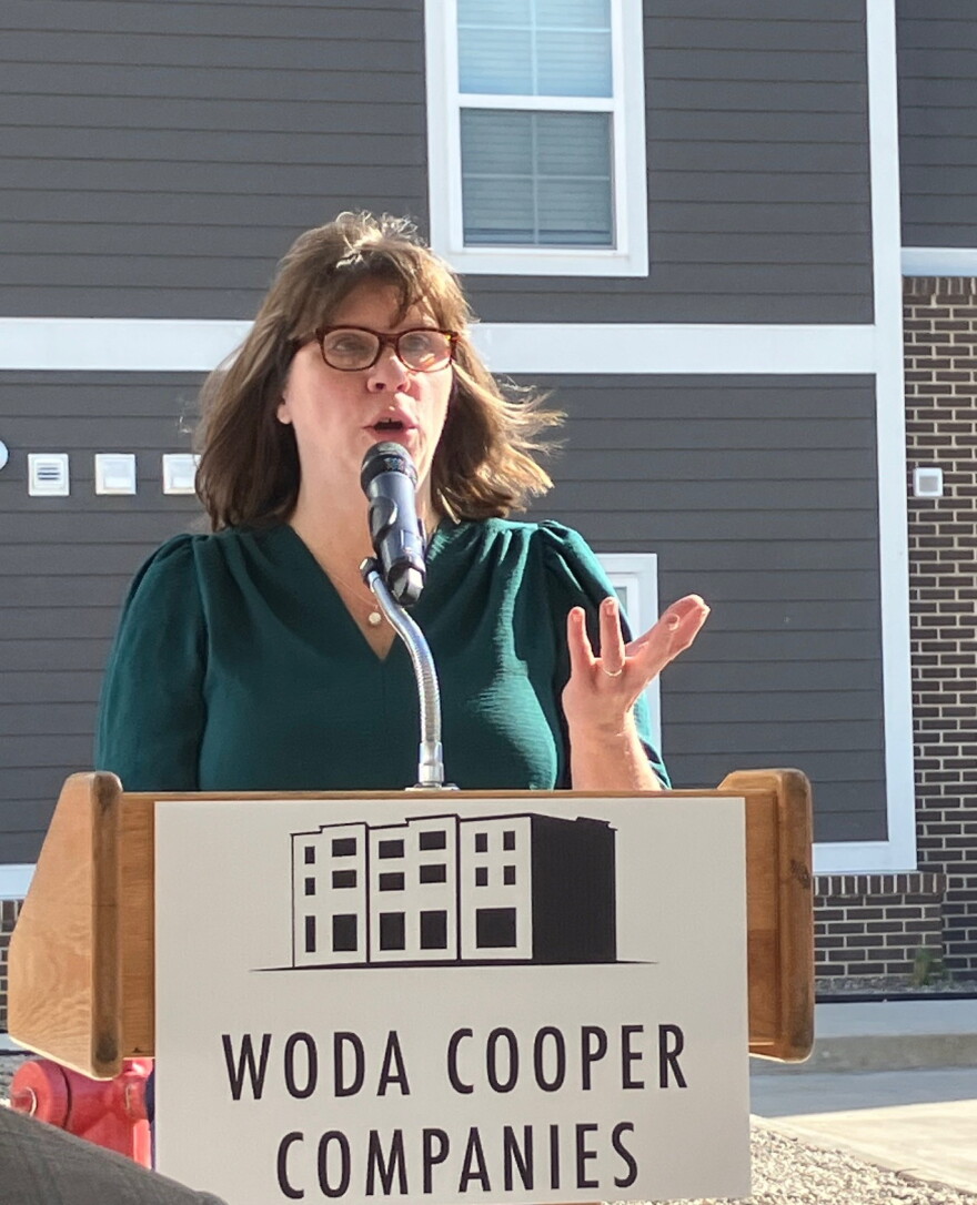 Leslie Kilgannon of the Quad Cities Housing Council, speaks at the Wednesday ribbon-cutting ceremony.