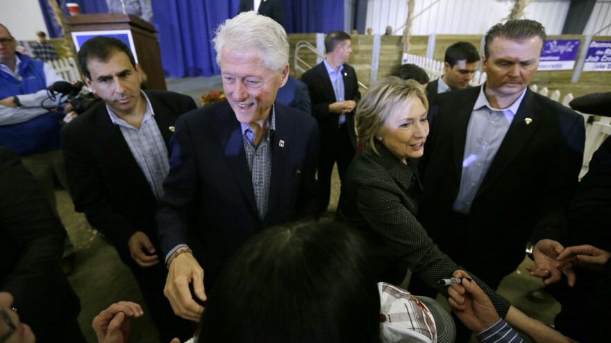 Bill and Hillary Clinton greet supporters at the Central Iowa Democrats Fall Barbecue in November. Bill Clinton is expected to have a greater presence on the campaign trail after the New Year.