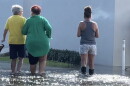 Hollywood residents wade through a king tide