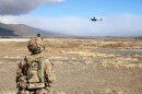 Pfc. Mason Davis, a drone operator with Delta Troop, 1st Platoon, Multipurpose Company, 3rd Squadron, 4th Cavalry Regiment, 3rd Mobile Brigade, 25th Infantry Division, watches a Ghost-X reconnaissance drone land after a mission on Pōhakuloa Training Area, Hawaiʻi, Nov. 13, 2025.