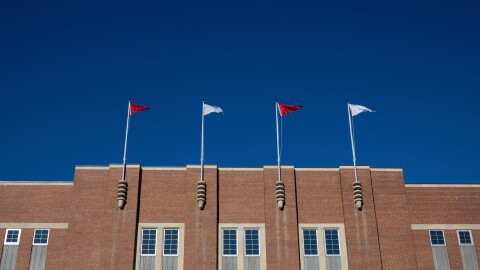 FILE - Flags fly at the Reynolds Coliseum at North Carolina State University Feb. 19, 2022, in Raleigh, N.C.