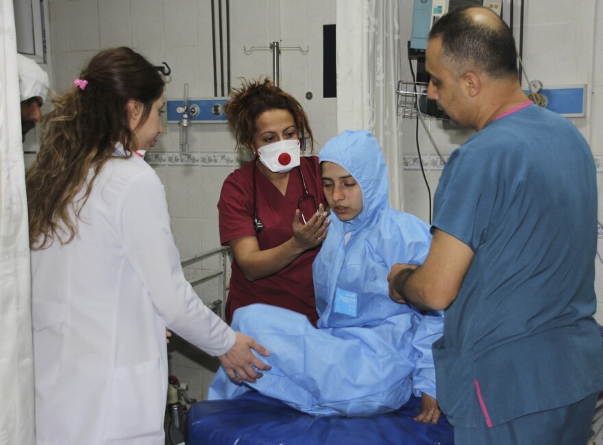 Medics at a local hospital in Hatay, Turkey, treat a victim of an attack across the border in Idlib, Syria, that experts suspect may have involved a powerful chemical weapon.