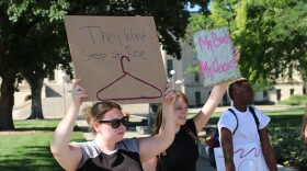 People outside the Kansas Statehouse protest the overturning of Roe v. Wade. 