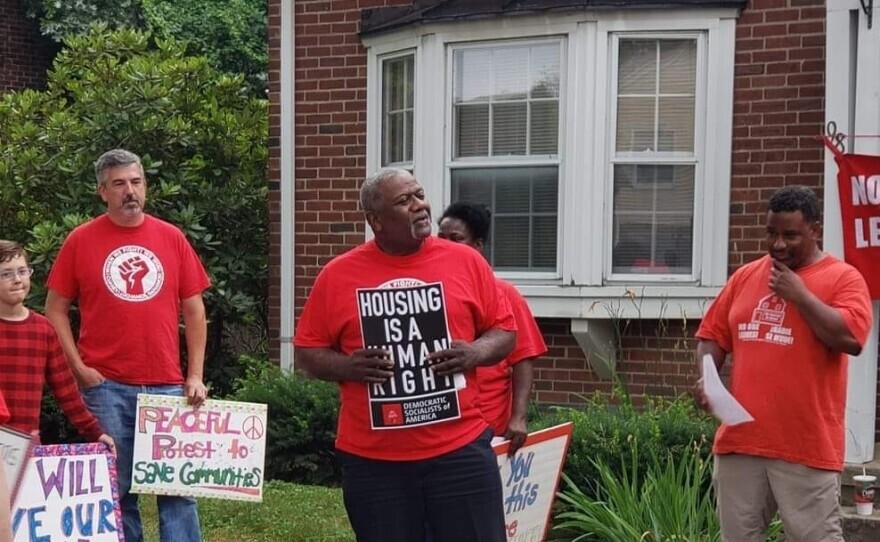 A group of Springfield No One Leaves  members hold signs advocating for better housing options in Massachusetts. 