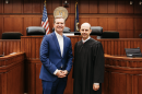 A photo on the campaign website of Judge Will Moynahan features him standing in a courtroom next to Gov. Andy Beshear (left), who is supporting him in his Kentucky Court of Appeals race.
