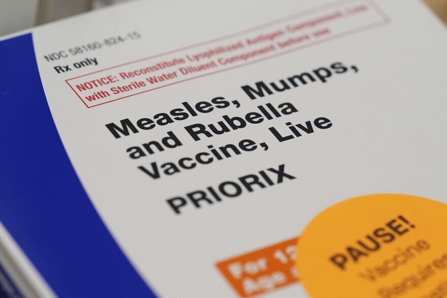 A box containing doses of the measles, mumps, and rubella vaccine (MMR) are displayed at a CVS Pharmacy, Tuesday, Sept. 9, 2025, in Miami. (AP Photo/Rebecca Blackwell)