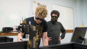 Two people in googles in a science lab.